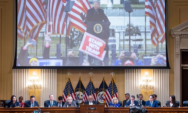 An image of former President Donald Trump is displayed as members of the House Select Committee to Investigate the January 6 Attack on the U.S. Capitol hold its last public meeting in the Canon House Office Building on Capitol Hill on December 19, 2022 in Washington, DC. The committee is expected to approve its final report and vote on referring charges to the Justice Department of insurrection, obstruction of an official proceeding of Congress and conspiracy to defraud the United States against former President Donald Trump. (Photo by Jim Lo Scalzo-Pool/Getty Images)