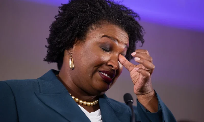 Democratic gubernatorial candidate Stacey Abrams wipes her eye during a concession speech to supporters during an election-night party on November 8, 2022 in Atlanta, Georgia. Abrams lost her bid for governor to incumbent Gov. Brian Kemp in a rematch of their 2018 race. (Photo by Jessica McGowan/Getty Images)