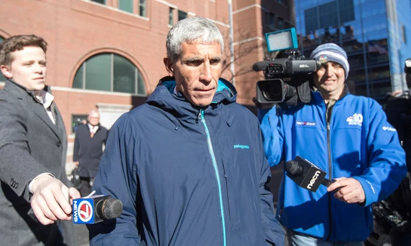 William "Rick" Singer leaves Boston Federal Court after being charged with racketeering conspiracy, money laundering conspiracy, conspiracy to defraud the United States, and obstruction of justice on March 12, 2019 in Boston, Massachusetts. Singer is among several charged in alleged college admissions scam. (Photo by Scott Eisen/Getty Images)