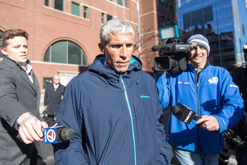 William "Rick" Singer leaves Boston Federal Court after being charged with racketeering conspiracy, money laundering conspiracy, conspiracy to defraud the United States, and obstruction of justice on March 12, 2019 in Boston, Massachusetts. Singer is among several charged in alleged college admissions scam.  (Photo by Scott Eisen/Getty Images)
