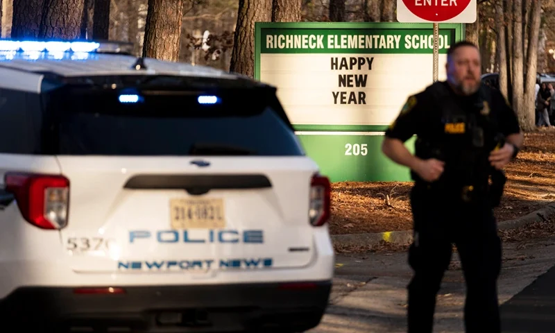 Police respond to a shooting at Richneck Elementary School, Friday, Jan. 6, 2023 in Newport News, Va. A shooting at a Virginia elementary school sent a teacher to the hospital and ended with “an individual” in custody Friday, police and school officials in the city of Newport News said.(Billy Schuerman/The Virginian-Pilot via AP)