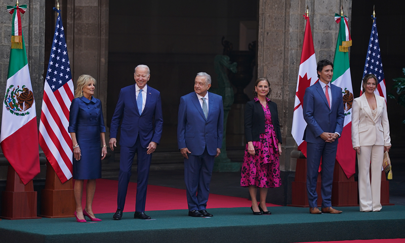 U.S., Mexican, and Canadian leaders and first ladies prepare to pose for a group photo before the start of a North America Summit at the National Palace in Mexico City, Tuesday, Jan. 10, 2023. From left are U.S. First Lady and President Jill and Joe Biden, Mexican President Andrés Manuel López Obrador and wife Beatriz Gutiérrez Müller, and Canada's Prime Minister Justin Trudeau and wife Sophie Grégoire Trudeau. (AP Photo/Fernando Llano)