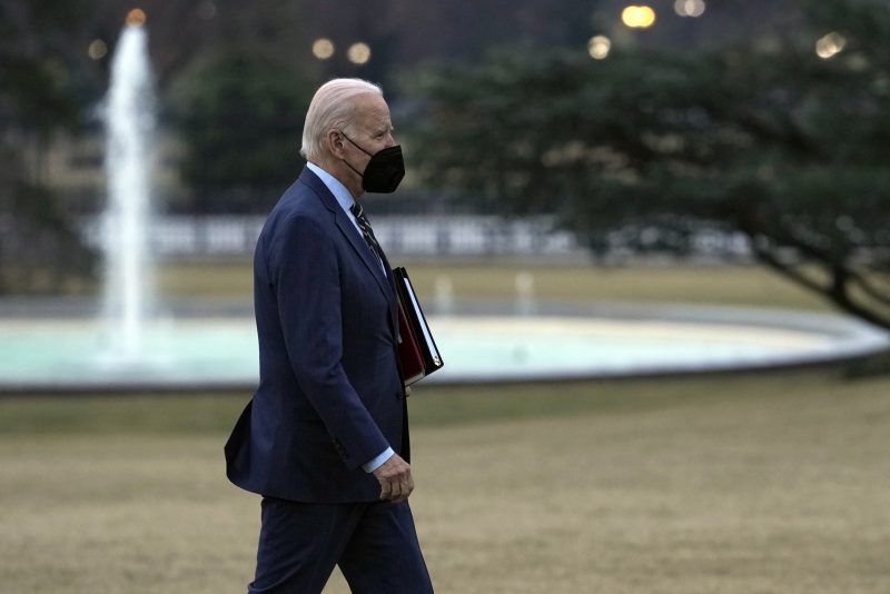 President Joe Biden walks from Marine One towards the Oval Office on the South Lawn of the White House in Washington, Wednesday, Jan. 11, 2023, after returning from Walter Reed National Military Medical Center where first lady Jill Biden had surgery to remove skin cancer. (AP Photo/Susan Walsh)