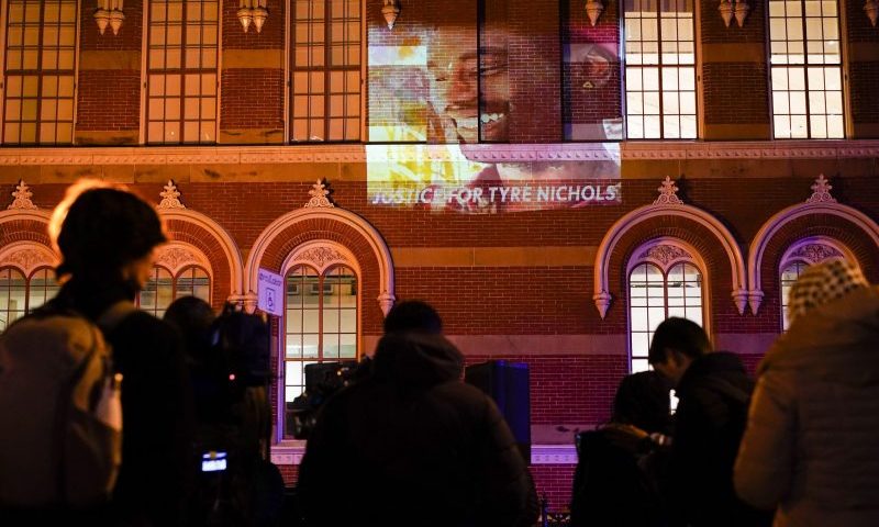 An image of Tyre Nichols, who died after being beaten by Memphis police officers on Jan. 7, is displayed on a building as people gather to protest over his death Friday, Jan. 27, 2023, in Washington. (AP Photo/Carolyn Kaster)
