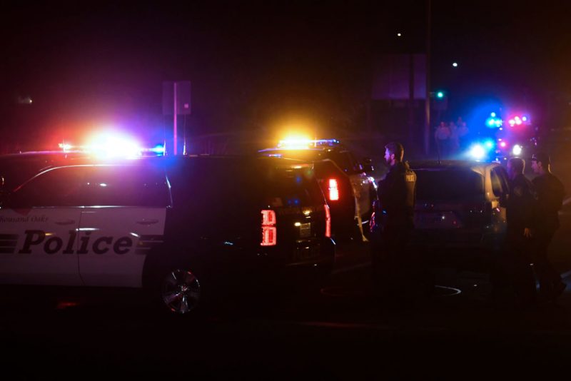 TOPSHOT - Police officers are seen at the intersection of US 101 freeway and the Moorpark Rad exit as police vehicles close off the area responding to a shooting at a bar in Thousand Oaks, California on November 8, 2018. - Twelve people, including a police sergeant, were shot dead in a shooting at a nighttclub close to Los Angeles, police said Thursday. All the victims were killed inside the bar in the suburb of Thousand Oaks late on Wednesday, including the officer who had been called to the scene, Sheriff Geoff Dean told reporters. The gunman was also dead at the scene, Dean added. The bar was hosting a college country music night. (Photo by Frederic J. BROWN / AFP)        (Photo credit should read FREDERIC J. BROWN/AFP via Getty Images)