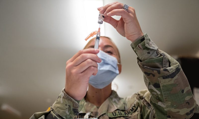 FORT KNOX, KY - SEPTEMBER 09: A Preventative Medicine Services technician fills a syringe with a Janssen COVID-19 vaccine on September 9, 2021 in Fort Knox, Kentucky. The Pentagon, with the support of military leaders and U.S. President Joe Biden, mandated COVID-19 vaccination for all military service members in early September. The Pentagon stresses inoculation from COVID-19 and other diseases to avoid outbreaks from impeding the fighting force of the US Military. (Photo by Jon Cherry/Getty Images)