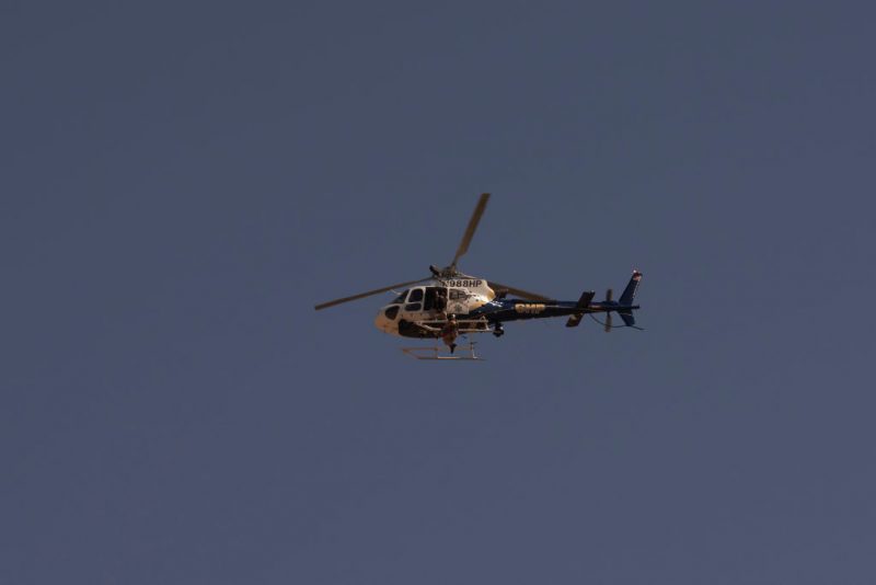 A California Highway Patrol helicopter flies enroute to help US Border Patrol agents recover the body of a deceased migrant from the Jacumba mountains on October 6, 2022 in Imperial County, California. - In the fiscal year 2022 the number of migrant apprehensions exceeded 2 million, a new record in US Border Patrol history, but these apprehensions include many repeat offenders. (Photo by allison dinner / AFP) (Photo by ALLISON DINNER/AFP via Getty Images)