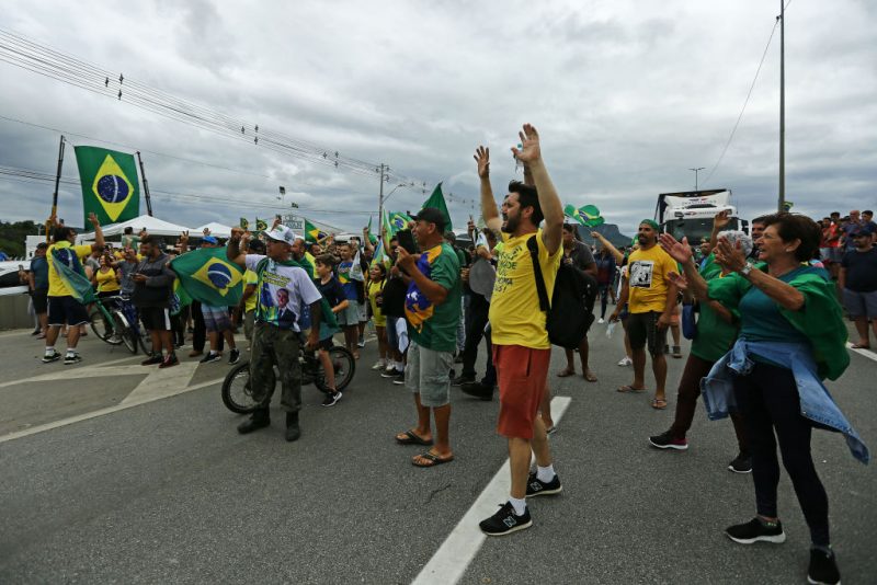 FLORIANOPOLIS, BRAZIL - OCTOBER 31: Truck drivers and supporters of President Jair Bolsonaro block Via Dutra to protest against the results of the presidential run-off on October 31, 2022 in Florianopolis, Brazil. Blockades have been registered in at least 11 states. Leftist leader Lula da Silva defeated incumbent Bolsonaro and will rule the country from January 2023. (Photo by Heuler Andrey/Getty Images)
