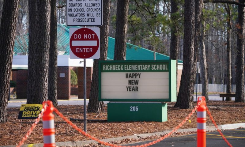 NEWPORT NEWS, VA - JANUARY 07: A school sign wishing students a "Happy New Year" is seen outside Richneck Elementary School on January 7, 2023 in Newport News, Virginia. A 6-year-old student was taken into custody after reportedly shooting a teacher during an altercation in a classroom at Richneck Elementary School on Friday. The teacher, a woman in her 30s, suffered “life-threatening” injuries and remains in critical condition, according to police reports. (Photo by Jay Paul/Getty Images)