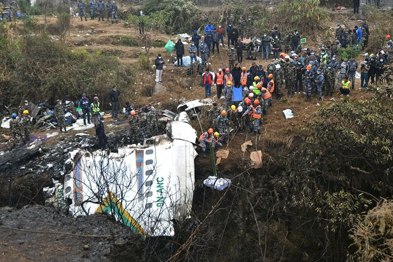 Graphic content / Rescuers pull the body of a victim who died in a Yeti Airlines plane crash in Pokhara on January 16, 2023. - Nepal observed a day of mourning on January 16 for the victims of the nation's deadliest aviation disaster in three decades, with 67 people confirmed killed in the plane crash. (Photo by PRAKASH MATHEMA / AFP) (Photo by PRAKASH MATHEMA/AFP via Getty Images)