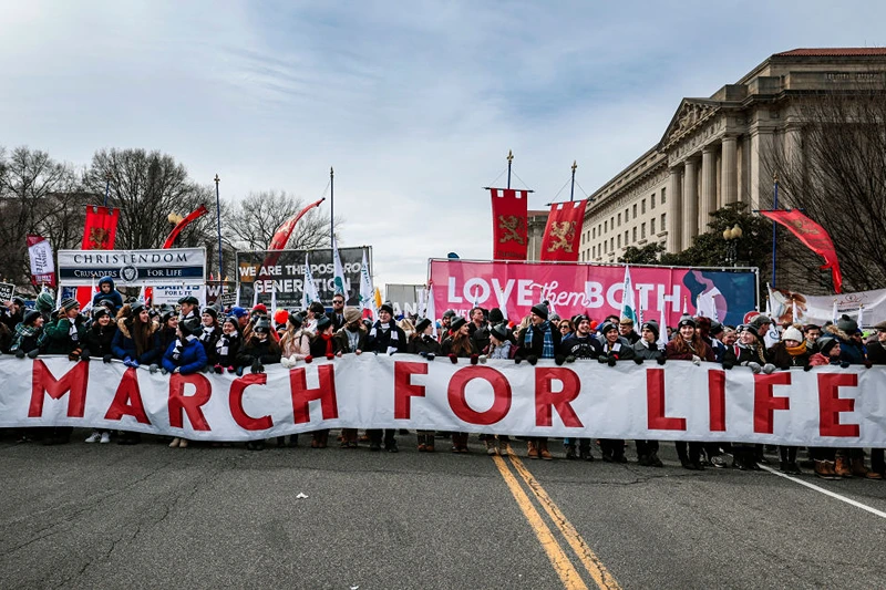 WASHINGTON, DC - JANUARY 21: Anti-abortion activists march to the U.S. Supreme Court during the 49th annual March for Life rally on January 21, 2022 in Washington, DC. The rally draws activists from around the country who are calling on the Court to overturn the Roe v. Wade decision that legalized abortion nationwide. (Photo by Anna Moneymaker/Getty Images)