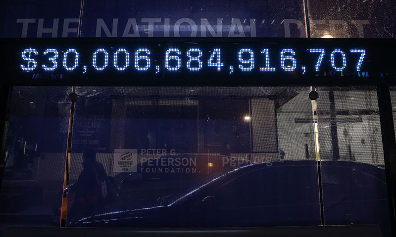 A Peterson Foundation billboard displaying the national debt is pictured on K Street on February 08, 2022 in downtown Washington, DC. (Photo by Jemal Countess/Getty Images for Peter G. Peterson Foundation)