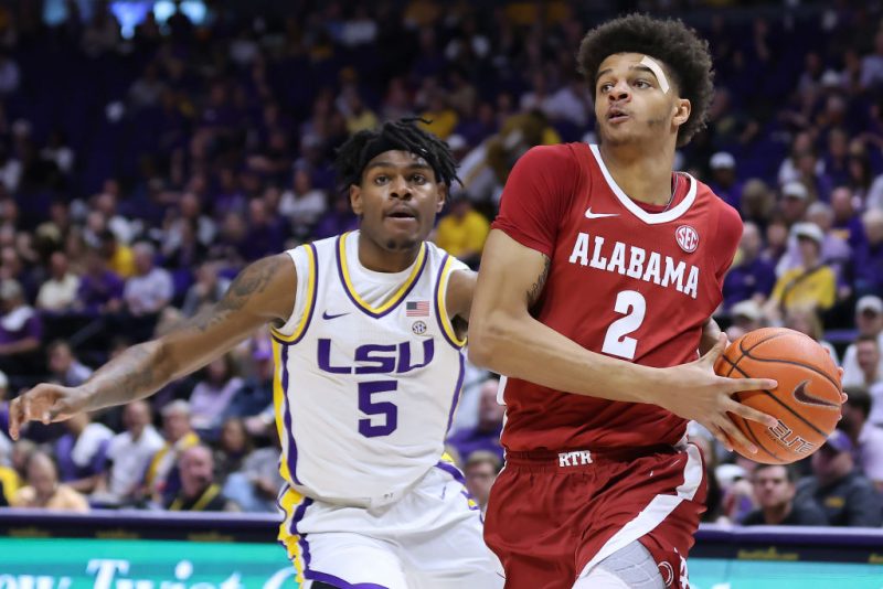 BATON ROUGE, LOUISIANA - MARCH 05: Darius Miles #2 of the Alabama Crimson Tide drives against Mwani Wilkinson #5 of the LSU Tigers during the first half at the Pete Maravich Assembly Center on March 05, 2022 in Baton Rouge, Louisiana. (Photo by Jonathan Bachman/Getty Images)