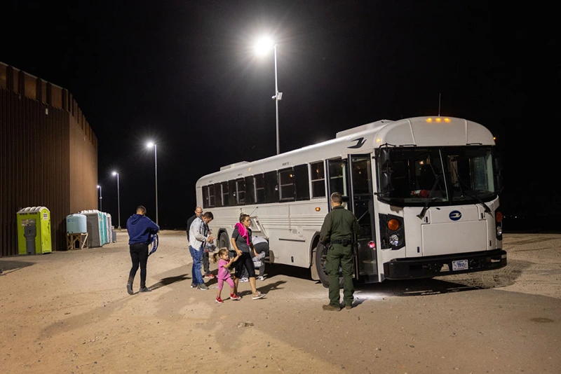 A U.S. Border Patrol agent prepares to transport a group of Cuban immigrants from the U.S.-Mexico border fence on September 27, 2022 in Yuma, Arizona. The number of immigrants crossing into the U.S. in 2022 is set to be the highest in recent history, surpassing the historic highs of 2021. Many immigrants crossing into the United States through Yuma are Cuban. (Photo by John Moore/Getty Images)