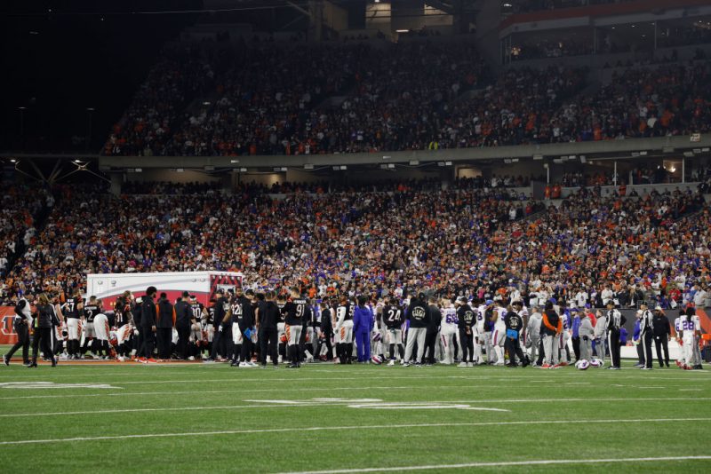 CINCINNATI, OHIO - JANUARY 02: Buffalo Bills and Cincinnati Bengals players look on as Damar Hamlin #3 of the Buffalo Bills is treated by medical personnel after being injured during the first quarter at Paycor Stadium on January 02, 2023 in Cincinnati, Ohio. (Photo by Kirk Irwin/Getty Images)