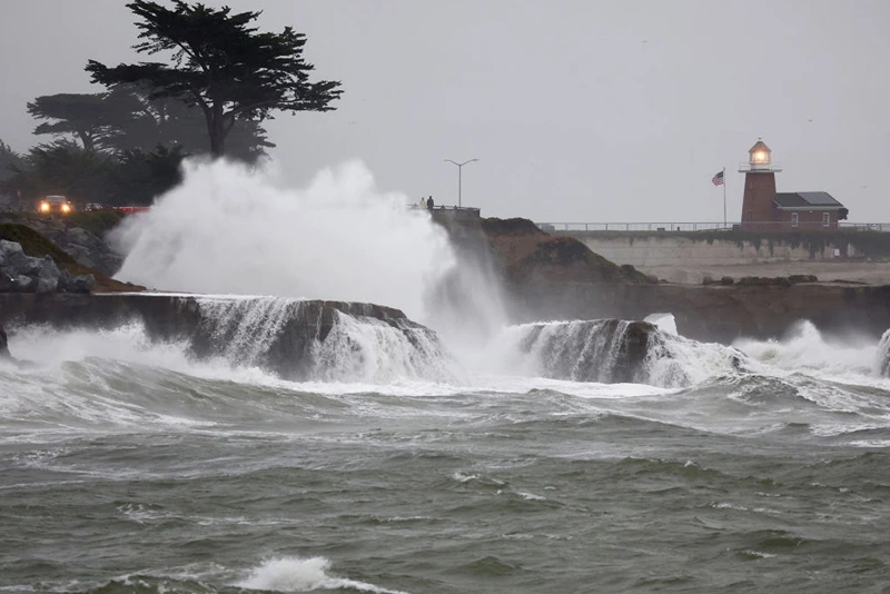 SANTA CRUZ, CALIFORNIA - JANUARY 11: Pacific Ocean waves break near Lighthouse Point on January 11, 2023 in Santa Cruz, California. The San Francisco Bay Area and much of Northern California continues to get drenched by powerful atmospheric river events that have brought high winds and flooding rains. The storms have toppled trees, flooded roads and cut power to tens of thousands. Storms are lined up over the Pacific Ocean and are expected to bring more rain and wind through the end of the week.  (Photo by Mario Tama/Getty Images)