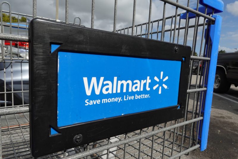 A cart sits outside of a Walmart store on January 24, 2023 in Miami, Florida. Walmart announced that it is raising its minimum wage for store employees in early March, store employees will make between $14 and $19 an hour. They currently earn between $12 and $18 an hour. (Photo by Joe Raedle/Getty Images)