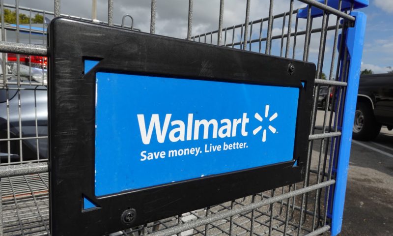 A cart sits outside of a Walmart store on January 24, 2023 in Miami, Florida. Walmart announced that it is raising its minimum wage for store employees in early March, store employees will make between $14 and $19 an hour. They currently earn between $12 and $18 an hour. (Photo by Joe Raedle/Getty Images)