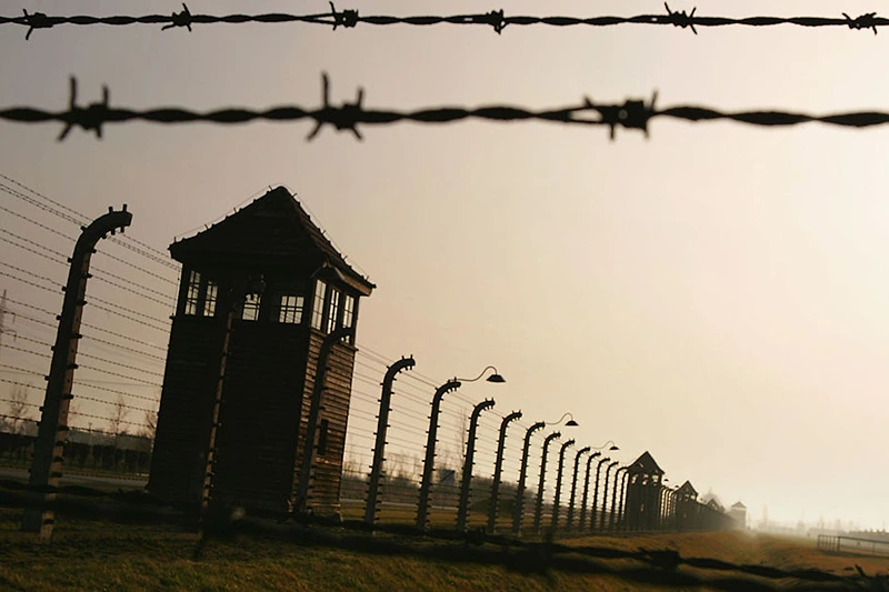 BREZEZINKA, POLAND - DECEMBER 10: Watch towers surrounded by mulitiple high voltage fences, December 10, 2004 at Auschwitz II - Birkenau which was built in March 1942 in the village of Brzezinka, Poland. (Photo by Scott Barbour/Getty Images)