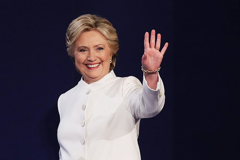 Democratic presidential nominee former Secretary of State Hillary Clinton waves to the crowd as she walks on the stage during the third U.S. presidential debate at the Thomas & Mack Center on October 19, 2016 in Las Vegas, Nevada. Tonight, is the final debate ahead of Election Day on November 8. (Photo by Drew Angerer/Getty Images)