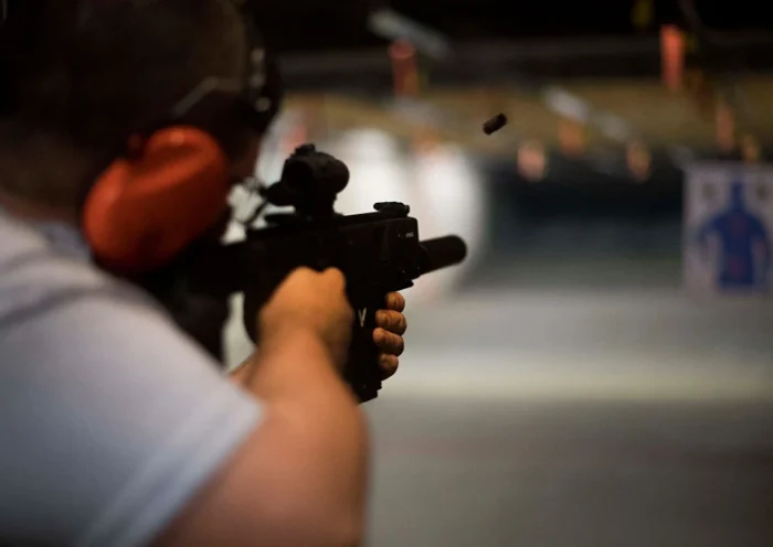 TOPSHOT - Ryan Salmon fires an assault rifle at the Lynchburg Arms & Indoor Shooting Range in Lynchburg, Virginia, on October 20, 2017. - Virginia residents go to the polls on November 7, 2017 to vote for governor and members of the state's legislature. Following a mass shooting in Las Vegas that killed 58 people and wounded nearly 500 earlier this month, gun control has become a key issue in the state's 2017 elections. The NRA has spent more than $750,000 in support of Republican gubernatorial candidate Ed Gillespie, whom the organization awarded an "A" rating "for his strong support of the Second Amendment" to the US Constitution, which guarantees the right to bear arms. (Photo by JIM WATSON / AFP) (Photo credit should read JIM WATSON/AFP via Getty Images)