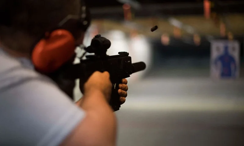 TOPSHOT - Ryan Salmon fires an assault rifle at the Lynchburg Arms & Indoor Shooting Range in Lynchburg, Virginia, on October 20, 2017. - Virginia residents go to the polls on November 7, 2017 to vote for governor and members of the state's legislature. Following a mass shooting in Las Vegas that killed 58 people and wounded nearly 500 earlier this month, gun control has become a key issue in the state's 2017 elections. The NRA has spent more than $750,000 in support of Republican gubernatorial candidate Ed Gillespie, whom the organization awarded an "A" rating "for his strong support of the Second Amendment" to the US Constitution, which guarantees the right to bear arms. (Photo by JIM WATSON / AFP) (Photo credit should read JIM WATSON/AFP via Getty Images)