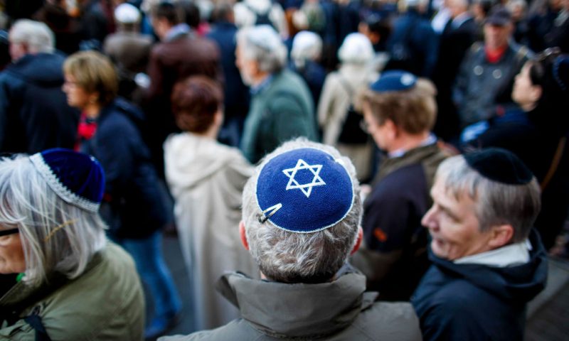 Participants wearing a kippah during a "wear a kippah" gathering to protest against anti-Semitism in front of the Jewish Community House on April 25, 2018.(Photo by Carsten Koall/Getty Images)