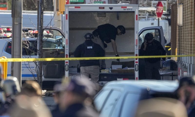 Members of the NYPD bomb squad examine a rental truck that was stopped and the driver arrested, Monday, Feb. 13, 2023, in New York. Police stopped a U-Haul truck and detained the driver after reports that the vehicle struck multiple pedestrians in New York City on Monday. Authorities say the driver of the truck fled the scene after mounting a sidewalk in the Bay Ridge neighborhood of Brooklyn and injuring several people. (AP Photo/John Minchillo)