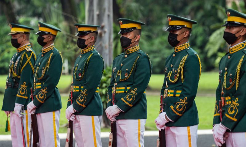 Members of a guard of honour look on US Vice President Kamala Harris arrives at Malacanang Palace in Manila on November 21, 2022. (Photo by Haiyun Jiang / POOL / AFP) (Photo by HAIYUN JIANG/POOL/AFP via Getty Images)