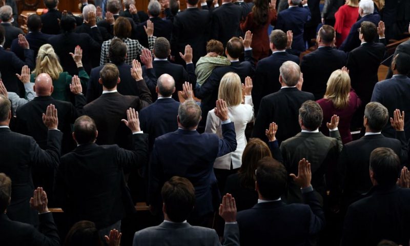 Newly elected Speaker of the US House of Representatives Kevin McCarthy (off frame) swears in the members of the 118th Congress at the US Capitol in Washington, DC, on January 7, 2023. - Kevin McCarthy's election to his dream job of speaker of the US House of Representatives was secured through a mix of bombproof ambition, a talent for cutting deals and a proven track record of getting Republicans what they need. He only won election as speaker after they forced him to endure 15 rounds of voting -- a torrid spectacle unseen in the US Capitol since 1859. (Photo by OLIVIER DOULIERY / AFP) (Photo by OLIVIER DOULIERY/AFP via Getty Images)