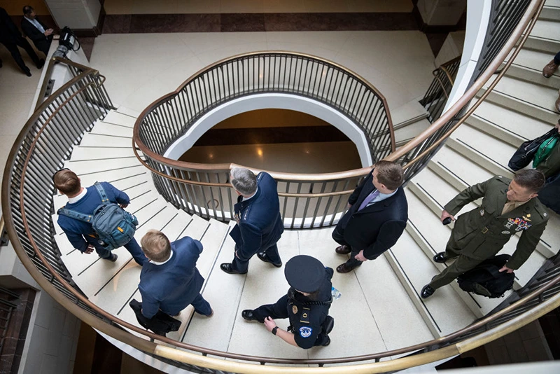 At center, General Glen VanHerck, Commander of U.S. Northern Command and North American Aerospace Defense Command, walks with security and military officials as he arrives for a closed-door briefing for Senators about the Chinese spy balloon at the U.S. Capitol February 9, 2023 in Washington, DC. Military and administration officials are briefing both houses of Congress today about the U.S. response to China's use of a spy balloon in American airspace. (Photo by Drew Angerer/Getty Images)