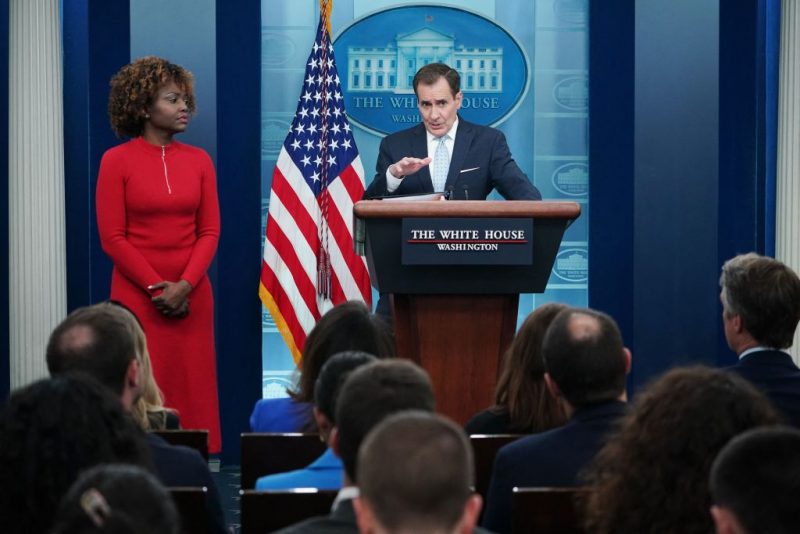 White House Press Karine Jean-Pierre watches as National Security Council Coordinator for Strategic Communications John Kirby (R) speaks during the daily press briefing in the James S Brady Press Briefing Room of the White House in Washington, DC, on February 13, 2023. (Photo by MANDEL NGAN / AFP) (Photo by MANDEL NGAN/AFP via Getty Images)