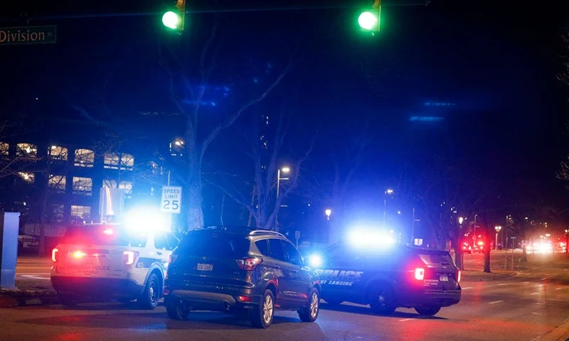 Police and emergency vehicles are on the scene of an active shooter situation on the campus of Michigan State University on February 13, 2023 in Lansing, Michigan. Five people were shot and the gunman still at large following the attack, according to published reports. The reports say some of the victims have life-threatening injuries. (Photo by Bill Pugliano/Getty Images)