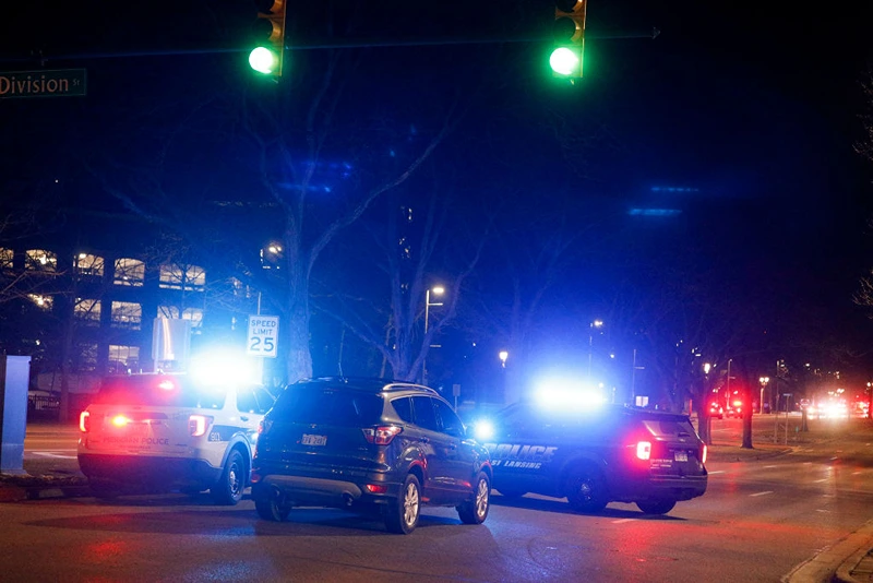 Police and emergency vehicles are on the scene of an active shooter situation on the campus of Michigan State University on February 13, 2023 in Lansing, Michigan. Five people were shot and the gunman still at large following the attack, according to published reports. The reports say some of the victims have life-threatening injuries. (Photo by Bill Pugliano/Getty Images)