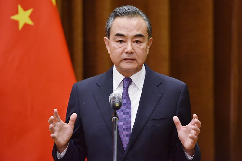 Chinese Foreign Minister Wang Yi speaks about the summit between US President Donald Trump and North Korean leader Kim Jong Un, during a joint briefing with Association of South East Asian Nations (ASEAN) Secretary-General Lim Jock Hoi at the Foreign Ministry in Beijing on June 12, 2018. (Photo by Greg Baker - Pool/Getty Images)