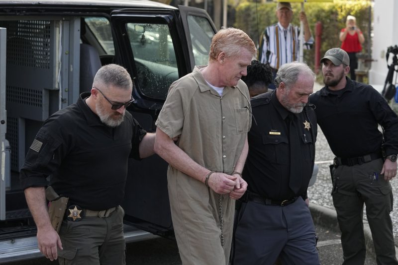 Alex Murdaugh is led to the Colleton County Courthouse by sheriff's deputies for sentencing Friday, March 3, 2023 in Walterboro, S.C., after being convicted of two counts of murder in the June 7, 2021, shooting deaths of Murdaugh's wife and son. (AP Photo/Chris Carlson)