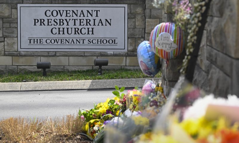 An an entry to Covenant School has become a memorial for shooting victims, Tuesday, March 28, 2023, in Nashville, Tenn. (AP Photo/John Amis)