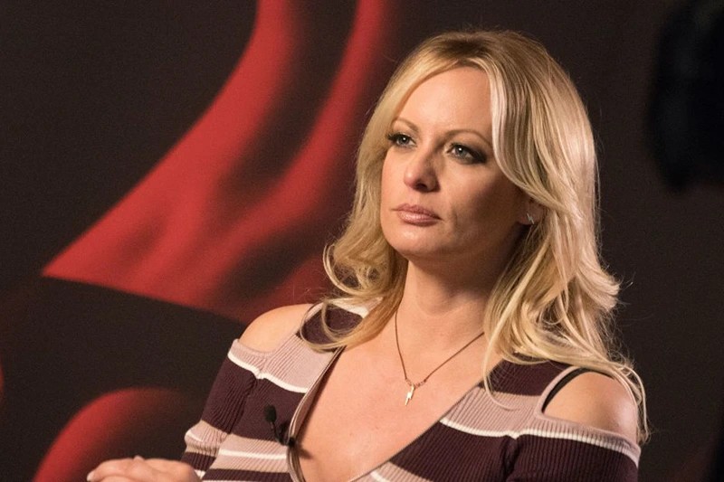Stormy Daniels, the porn star who claims to have slept with US President Donald Trump over a decade ago, talks with a journalist during an interview at the Berlin erotic fair "Venus" in Berlin on October 11, 2018. (Photo by Ralf Hirschberger / dpa / AFP) / Germany OUT (Photo credit should read RALF HIRSCHBERGER/DPA/AFP via Getty Images)