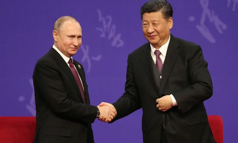 Russian President Vladimir Putin, left, shakes hands with Chinese President Xi Jinping, right, during the Tsinghua Universitys ceremony, at Friendship palace on April 26, 2019 in Beijing, China. (Photo by Kenzaburo Fukuhara - Pool/Getty Images)