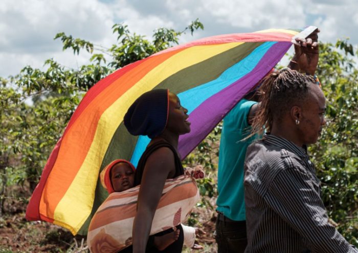 LGBT refugees from South Sudan, Uganda and DR Congo walk on the way to their protest to demand their protection at the office of the United Nations High Commissioner for Refugees (UNHCR) in Nairobi, Kenya, on May 17, 2019. - According to them, they have fled from Kakuma and Dadaab refugee camps in northern Kenya to avoid life threatened incidents and stayed in front of UNHCR office building in Nairobi since January. (Photo by Yasuyoshi CHIBA / AFP) (Photo credit should read YASUYOSHI CHIBA/AFP via Getty Images)