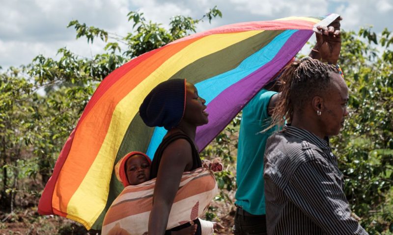 LGBT refugees from South Sudan, Uganda and DR Congo walk on the way to their protest to demand their protection at the office of the United Nations High Commissioner for Refugees (UNHCR) in Nairobi, Kenya, on May 17, 2019. - According to them, they have fled from Kakuma and Dadaab refugee camps in northern Kenya to avoid life threatened incidents and stayed in front of UNHCR office building in Nairobi since January. (Photo by Yasuyoshi CHIBA / AFP) (Photo credit should read YASUYOSHI CHIBA/AFP via Getty Images)