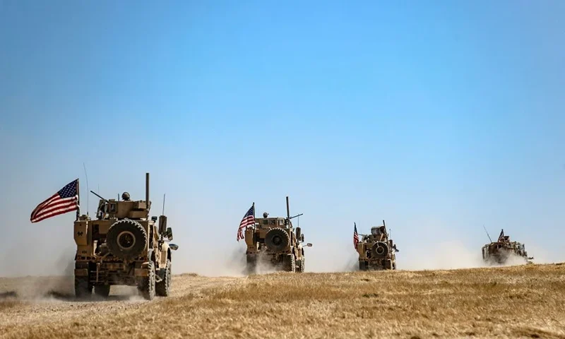 A US military convoy takes part in joint patrol with Turkish troops in the Syrian village of al-Hashisha on the outskirts of Tal Abyad town along the border with Turkish troops, on September 8, 2019. - The United States and Turkey began joint patrols in northeastern Syria aimed at easing tensions between Ankara and US-backed Kurdish forces. Six Turkish armoured vehicles crossed the border to join US troops in Syria for their first joint patrol under a deal reached between Washington and Ankara, an AFP journalist reported. (Photo by Delil SOULEIMAN / AFP) (Photo by DELIL SOULEIMAN/AFP via Getty Images)