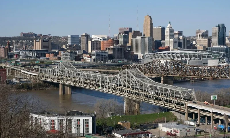 The Brent Spence Bridge spans the Ohio River on the Ohio-Kentucky border in Cincinnati, Ohio on April 2, 2021. - US President Biden has announced an ambitious $2 trillion infrastructure plan that would pump huge sums of money into improving the nations bridges, roads, public transportation, railways, ports and airports. The Brent Spence Bridge, which connects Covington to Cincinnati via Interstates 71 and 75, is considered to be "functionally obsolete" due to the amount of daily traffic it carries, which is nearly double for its original design. (Photo by Jeff Dean / AFP) (Photo by JEFF DEAN/AFP via Getty Images)