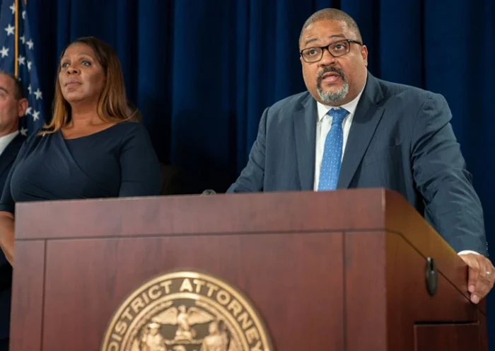 New York State Attorney General Letitia James (L) looks on as Manhattan District Attorney Alvin Bragg speaks at a press conference after Steve Bannon, former advisor to former President Donald Trump surrendered at the NY District Attorney's office to face charges on September 08, 2022 in New York City. Bannon faces a new criminal indictment that will mirror the federal case in which he was pardoned by former President Donald Trump. He and others have been alleged to have defrauded contributors to a private $25 million fundraising effort to build a wall along the U.S.-Mexico border according. (Photo by David Dee Delgado/Getty Images)