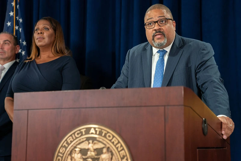  New York State Attorney General Letitia James (L) looks on as Manhattan District Attorney Alvin Bragg speaks at a press conference after Steve Bannon, former advisor to former President Donald Trump surrendered at the NY District Attorney's office to face charges on September 08, 2022 in New York City. Bannon faces a new criminal indictment that will mirror the federal case in which he was pardoned by former President Donald Trump. He and others have been alleged to have defrauded contributors to a private $25 million fundraising effort to build a wall along the U.S.-Mexico border according. (Photo by David Dee Delgado/Getty Images)