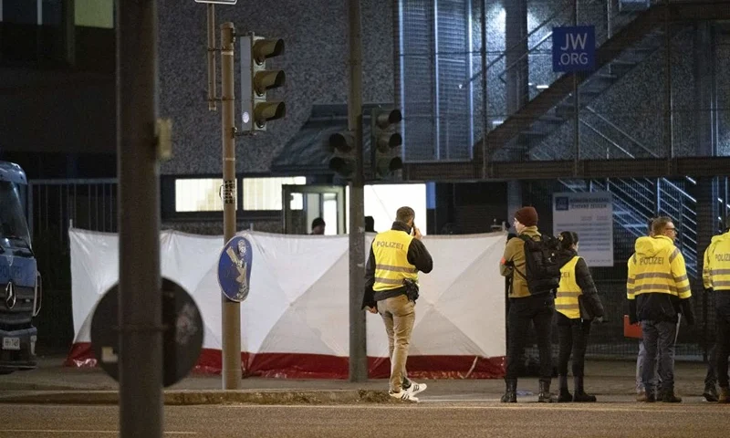 Police stand outside a Jehovah's Witnesses church where several people have been killed in a shooting in Hamburg, northern Germany, on late March 9, 2023. - The gunman is believed to be among several dead found in the building, police said (Photo by Daniel Reinhardt / AFP) (Photo by DANIEL REINHARDT/AFP via Getty Images)
