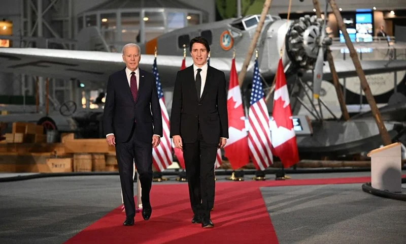 US President Joe Biden and Canada's Prime Minister Justin Trudeau arrive to attend a gala dinner hosted Justin Trudeau and his wife Sophie Gregoire Trudeau at the Canadian Aviation and Space Museum in Ottawa, Canada, on March 24, 2023. (Photo by Mandel NGAN / AFP) (Photo by MANDEL NGAN/AFP via Getty Images)