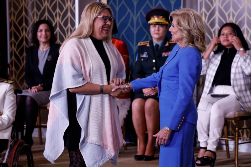 Alba Rueda, from Argentina, is presented with an award by first Lady Jill Biden and U.S. Secretary of State Antony J. Blinken at the 17th annual International Women of Courage (IWOC) Award Ceremony in the East Room of the White House on March 08, 2023 in Washington, DC. First Lady Biden and Blinken hosted the ceremony to award women from around the world who have shown courage in their careers ranging from journalism, advocacy, the military and more. (Photo by Anna Moneymaker/Getty Images)