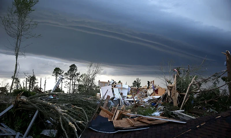 An ominous looking cloud hangs above the remains of a home that was destroyed yesterday by a tornado on April 29, 2014 in Tupelo, Mississippi. A deadly tornado ripped through the area April 28, after storms moved through the south spawning tornadoes that have left more than a dozen dead. Forecasters have warned more tornadoes and severe storms could be on the way. (Photo by Joe Raedle/Getty Images)