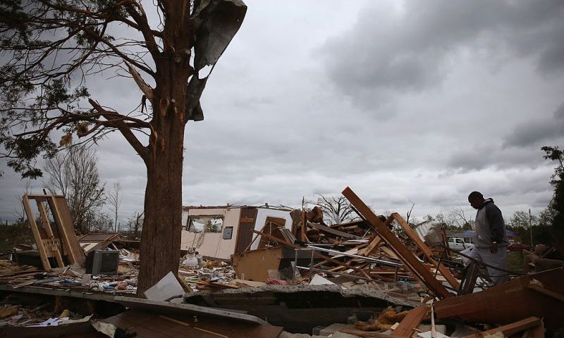 James Guideen looks for personal items in the remains of his house that was destroyed by a tornado, April 30, 2014 in Mayflower, Arkansas. Deadly tornadoes ripped through the region starting on April 27 leaving more than two dozen dead. The storm system has also brought severe flooding to Florida's Panhandle. (Photo by Mark Wilson/Getty Images)